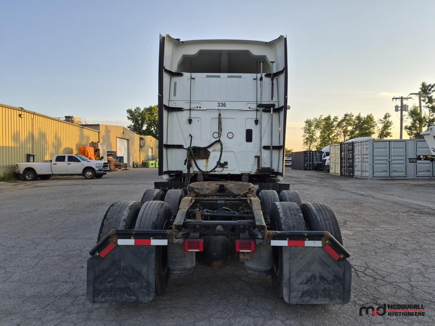 Rear view of a 2021 International LT625 T/A Sleeper Semi Truck showing chassis, tandem axles, and rear doors. Some numbers and labels on the back of the cab read '336'.