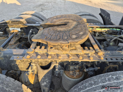 Truck engine bay showing air reservoir and fifth wheel on a 2021 International LT625 T/A Sleeper with dirt and grime.