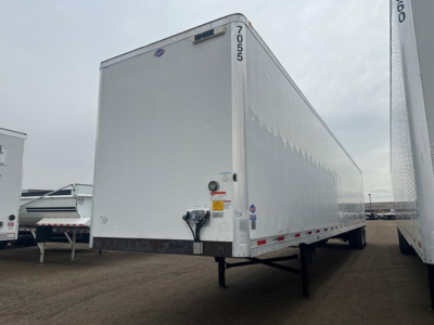 Trailer side view showing 2018 Utility 4000Dx box trailer with white exterior, front hitch, and support legs.