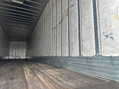 Trailer interior showing metal sidewalls and wooden floor in a Utility 4000Dx trailer.