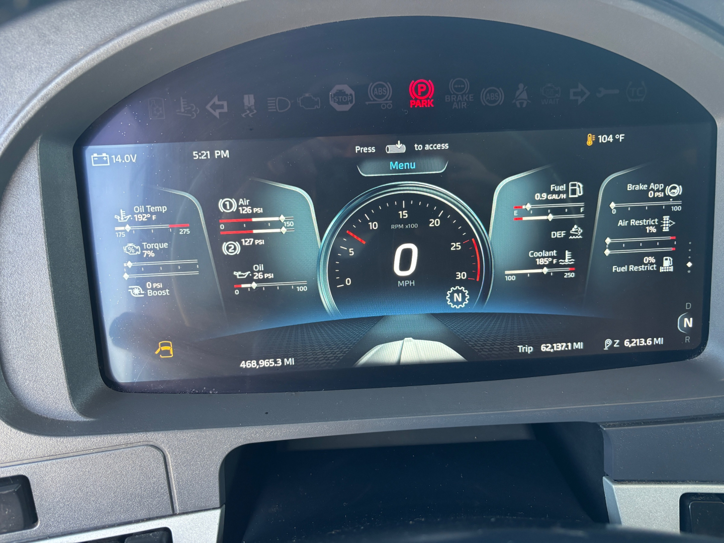 Kenworth T680 instrument cluster digital dash display showing vehicle speed 0 mph, fuel, oil, temp gauges, and trip data.