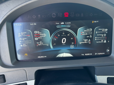 Kenworth T680 instrument cluster digital dash display showing vehicle speed 0 mph, fuel, oil, temp gauges, and trip data.