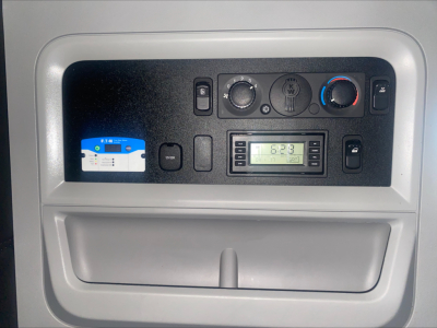 Kenworth T680 dash panel showing climate controls and radio/display unit.