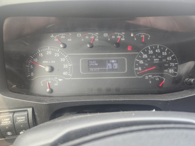 Dashboard of a 2020 International MV607 showing analog gauges and a digital display in center.