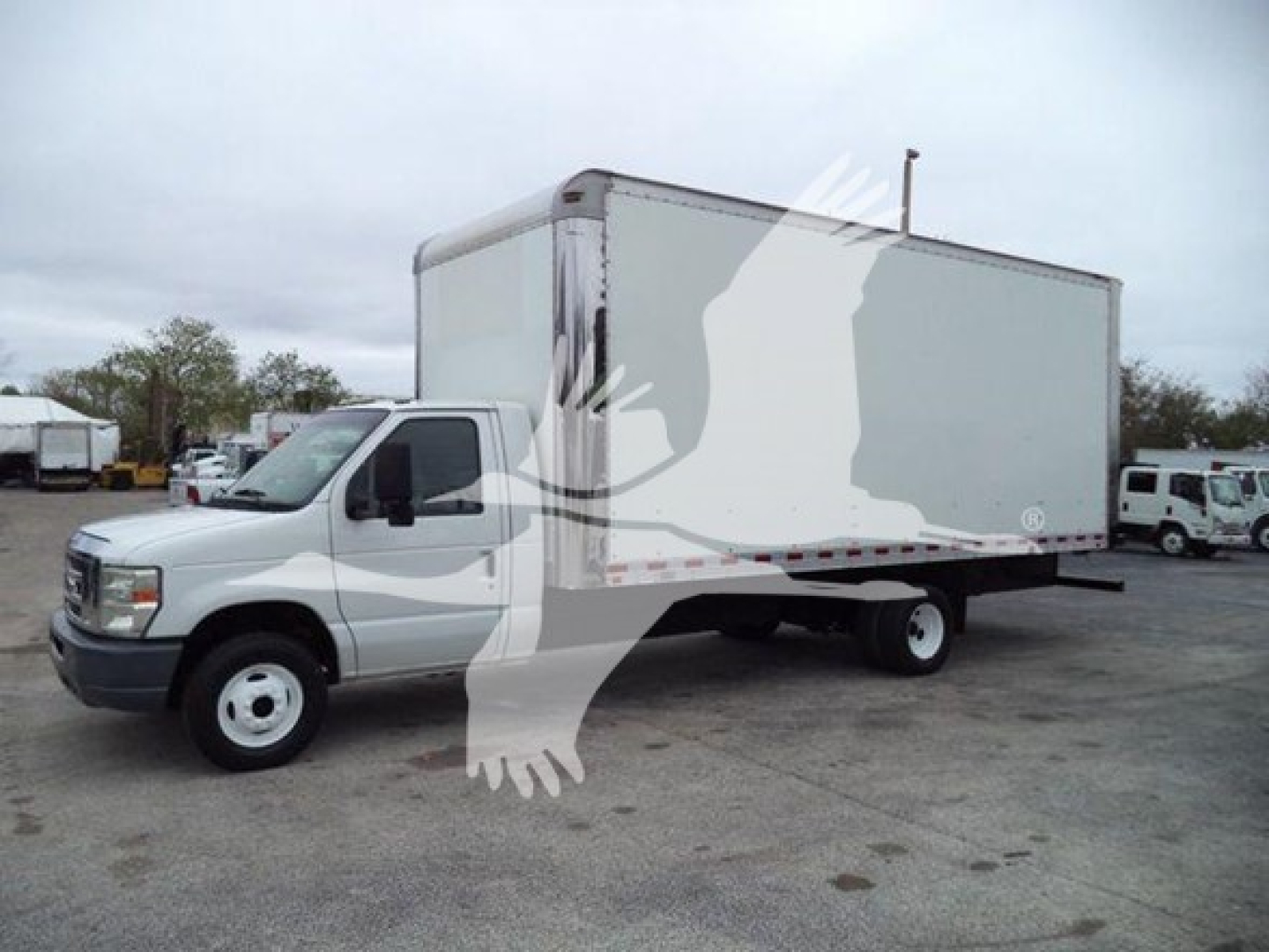 Box truck showing 2011 Ford E450 with a large box body and white cab, stock number T17033, VIN 1FDXE4FS7BDB17033.