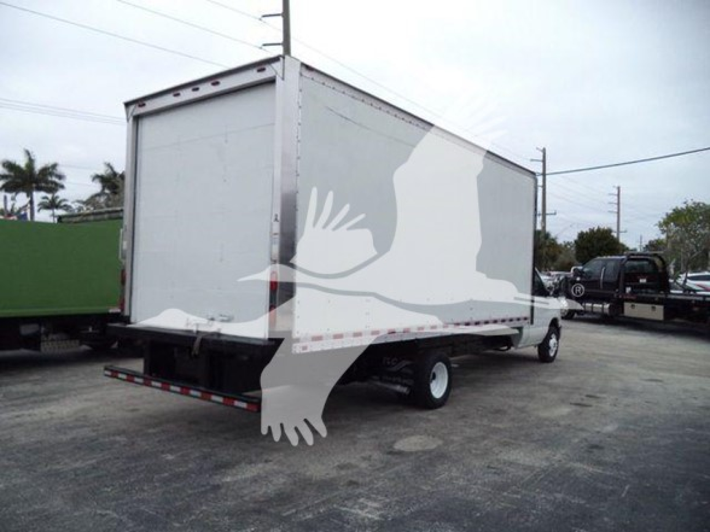 Box truck 2011 Ford E450 rear and side view showing cargo box, white/gray exterior, no visible branding text.