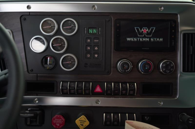 Dashboard panels of a Western Star 47X truck showing multiple gauges, warning lights, and a Western Star display.