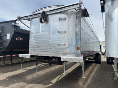 Dump trailer showing rear and side views with aluminum diamond plate and folded tarp mechanism.