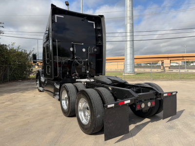 Kenworth T680 truck rear view showing chassis and dual rear axles with mud flaps and fifth wheel removed.