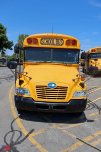Front view of a 2018 Blue Bird Vision school bus in yellow with 'SCHOOL BUS' sign, black bumper, and blue emblem on grille.