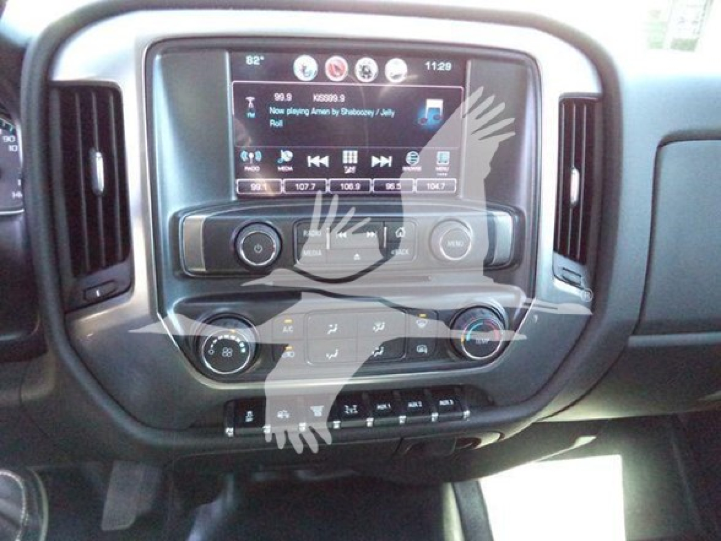 Dashboard view of a 2023 Chevrolet Silverado 6500HD interior showing infotainment screen and climate controls.