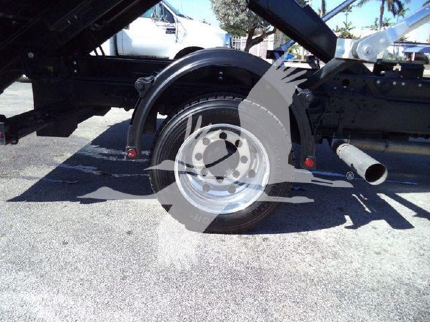 Chevrolet Silverado 6500HD truck wheel and undercarriage view with trailer hitch and debris shield