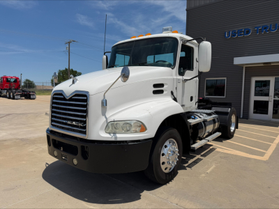White 2018 Mack CXU612 conventional daycab truck shown in a dealership lot with front grille, cab, and dual rear axles missing trailer.
