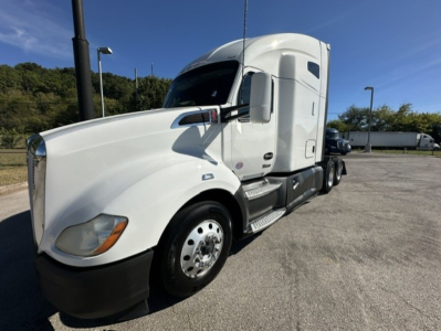 Kenworth T680 conventional sleeper truck in white, front-left view with cab and wheel visible.