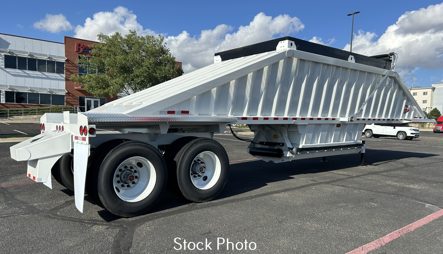 Trailer side view showing CTS BDT40 Spring Slp Sheets dump trailer with dual rear axles and white finish.