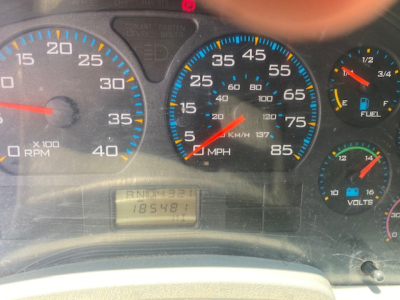 Instrument cluster of a 2007 International 7400 showing speedometer up to 85 MPH, tachometer up to 40 x100 RPM, and various gauges including fuel and volts.