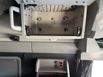 Vehicle interior storage compartment with empty center console and surrounding panels; no legible model text visible in the image.