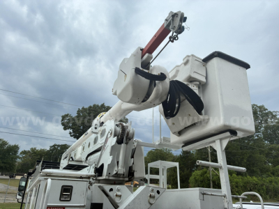 Freightliner M2 106 bucket truck crane arm with bucket platform and hydraulic lifting mechanism.