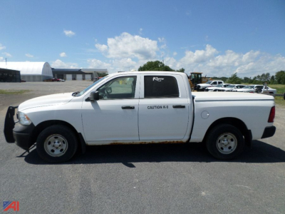 2017 Ram 1500 Crew Cab pickup truck side view showing single cab with rear bed, white paint, caution decal on door, in-service condition