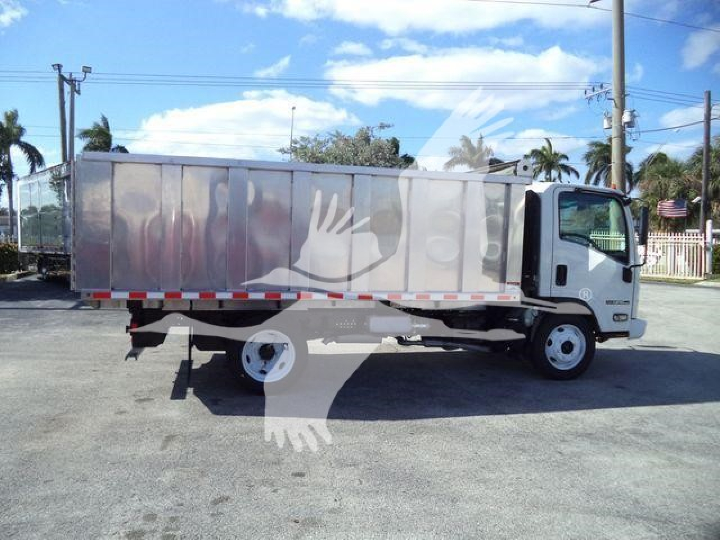 Isuzu NPR HD truck with aluminum dump body side view showing cab and cargo area