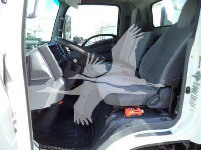 Isuzu NPR HD truck cab interior showing driver and passenger seats, steering wheel, and dashboard view.