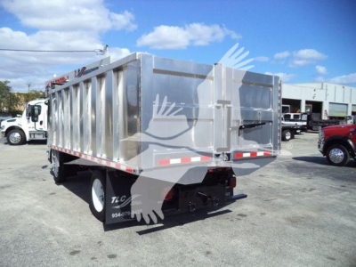 Isuzu NPR-HD dump truck in rear three-quarter view showing cargo bed and taillights.