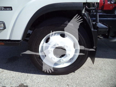 Isuzu NPR HD truck front wheel and fender showing wheel rim and tire with a partial view of the chassis.