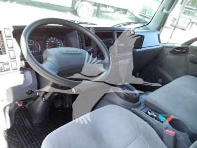 Isuzu NPR HD interior showing steering wheel, dashboard, and front seats.