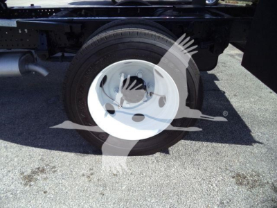 Isuzu NPR HD truck wheel and tire showing white steel wheel and hub area.