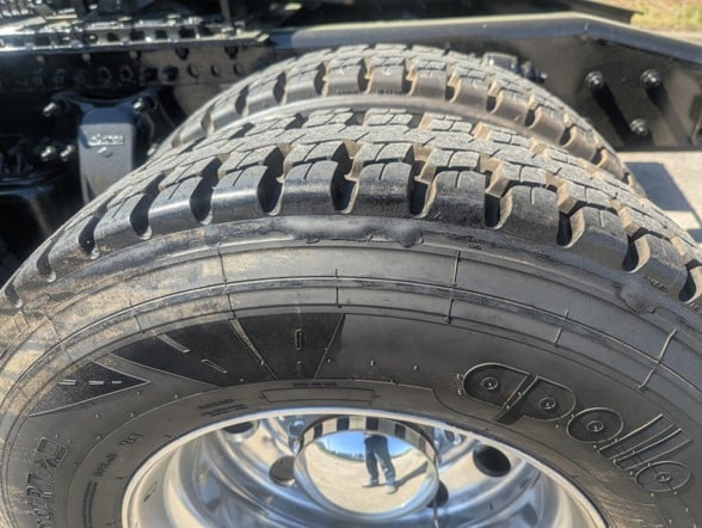 Tires on Freightliner Cascadia 126 truck frame showing rugged tread and wheel rim.