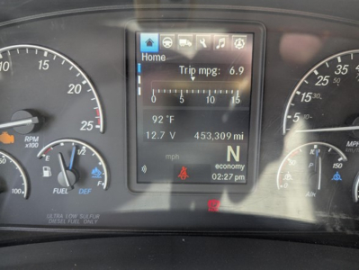 Dashboard display of a 2022 Freightliner Cascadia 126 with center touchscreen showing trip mpg 6.9, outside air temp 92°F, 12.7V, 453,309 miles, economy clock 02:27 PM.