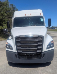 Front view of a white Freightliner Cascadia 126 truck showing grille, headlights, and bumper.