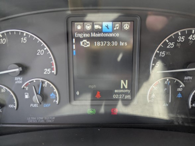 Freightliner Cascadia dashboard showing engine maintenance screen with 18373:30 hours and N gear.