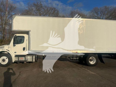 Freightliner M2 106 box truck side view showing cargo box and cab.