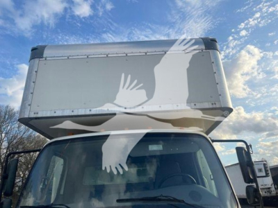 2019 Freightliner M2 106 truck cab with a large box over the cab; visible text includes VIN and stock number in listing, general vehicle type.