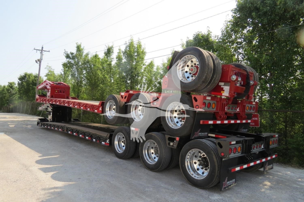 Lowboy trailer with a red removable gooseneck and multiple axles on a flatbed trailer, stock number 53-5996, VIN 4U3J0533XML019396.