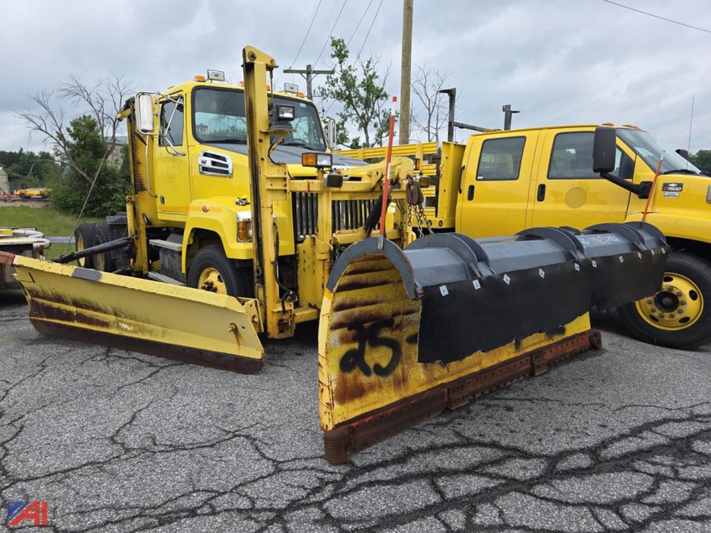 2015 Western Star 4700 SF cab and chassis with plow and Viking Wing snowplow setup, yellow vehicles, front plow blade and snow accumulation equipment visible.
