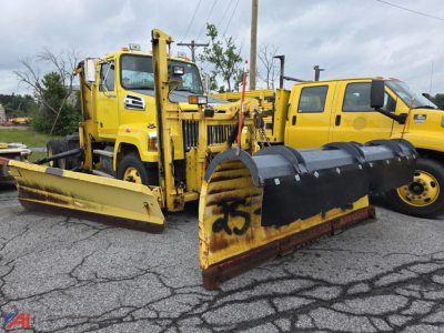 2015 Western Star 4700 SF cab and chassis with plow and Viking Wing snowplow setup, yellow vehicles, front plow blade and snow accumulation equipment visible.