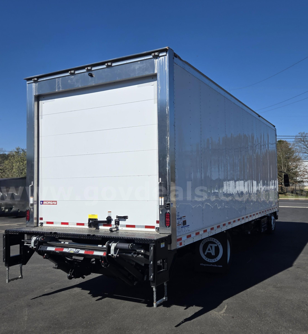 Isuzu NPR box truck rear view showing roll-up cargo door and bumper with hitch, used stock #29174-74.