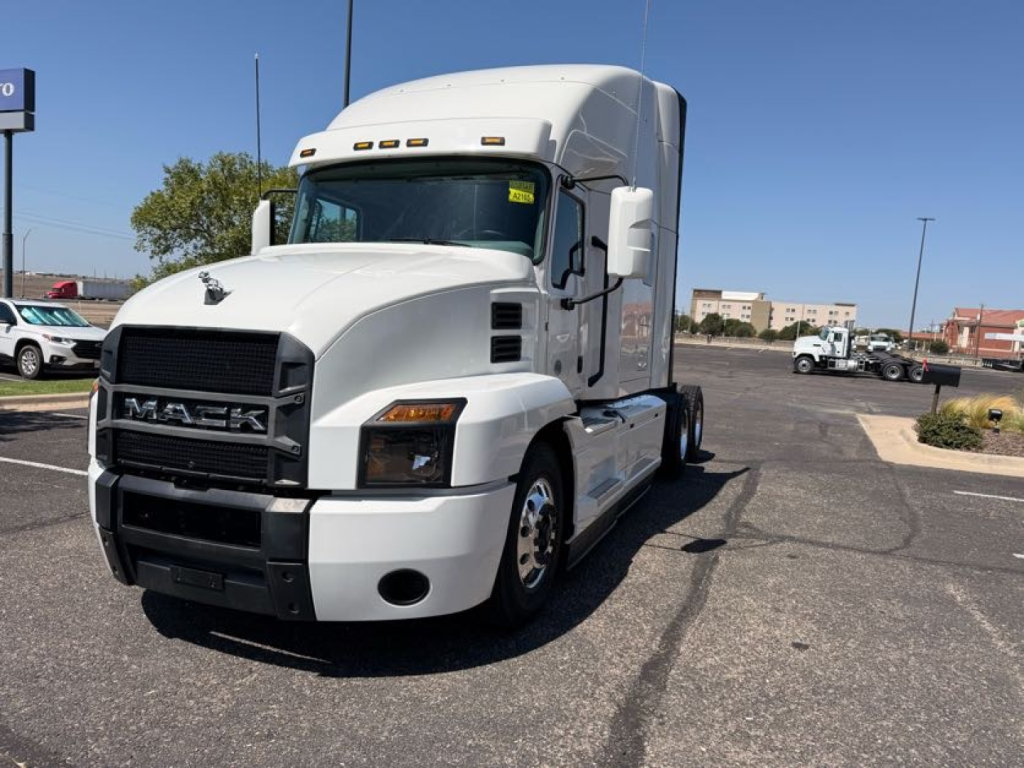White 2020 Mack Anthem conventional sleeper truck with grille and cab, front view, shows Mack logo on grille and headlights