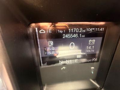 Dashboard display of a 2020 Mack Anthem showing odometer/trip data, RPM/voltage readouts, and gear indicator in the instrument cluster.