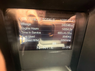 Dashboard display showing vehicle totals: Mileage 245,546 mi, Engine Hours 14,354.5 h, Time in Service 600d 4h 10m, Fuel Used 35,404 gal, Highest RPM 2250, gear N N N E.
