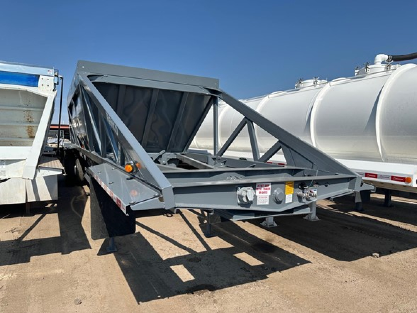 Ranco LW21-40 trailer in a dump trailer setup showing the front hitch and side rails.