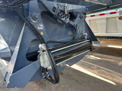 Ranco LW21-40 trailer component showing hydraulic hoses and hydraulic cylinder assembly with metal frame and control wiring.