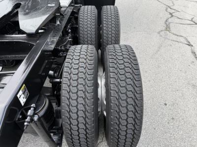 Peterbilt 579 chassis with dual rear axles and tires in view, showing wheel rims and suspension components.