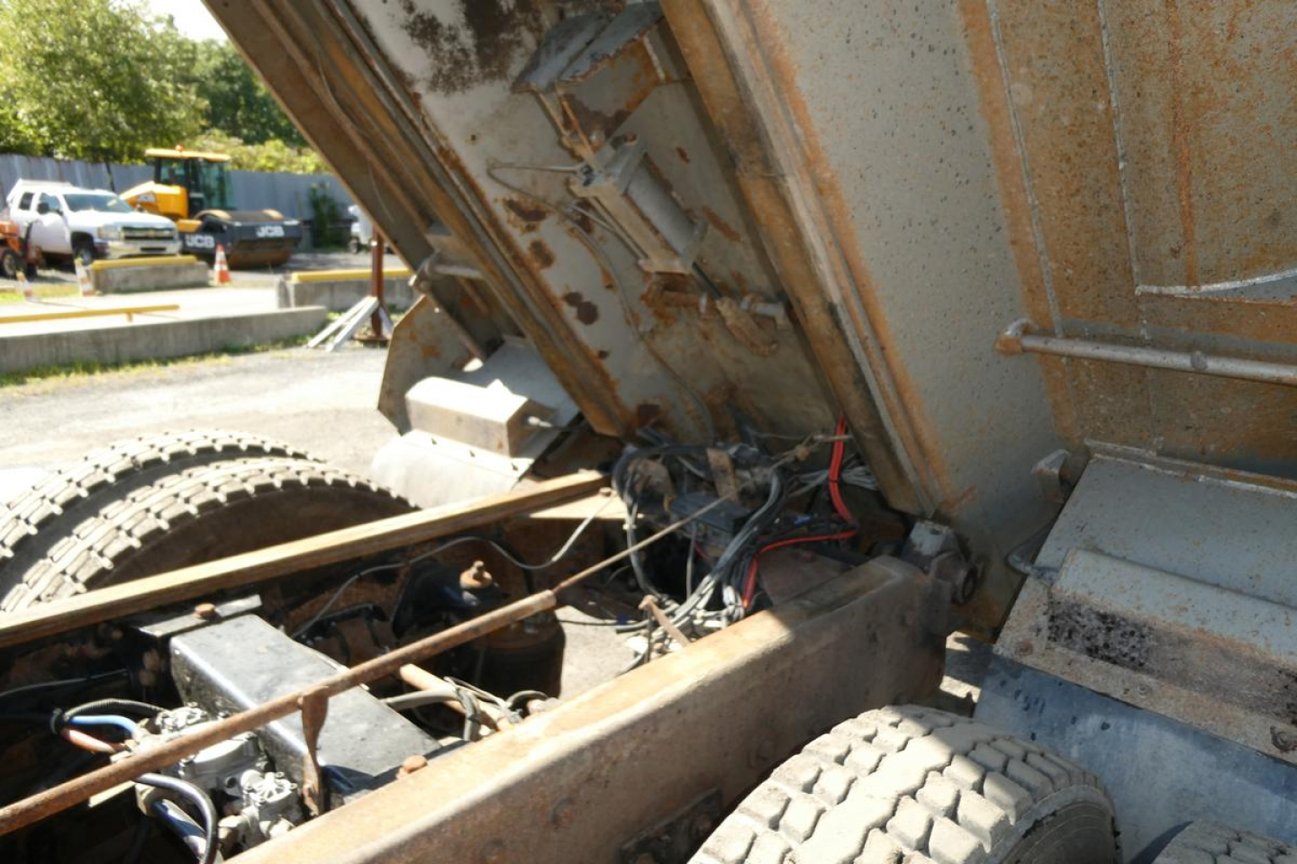 Peterbilt 357 dump truck bed interior showing hydraulic lines and chassis with exposed components