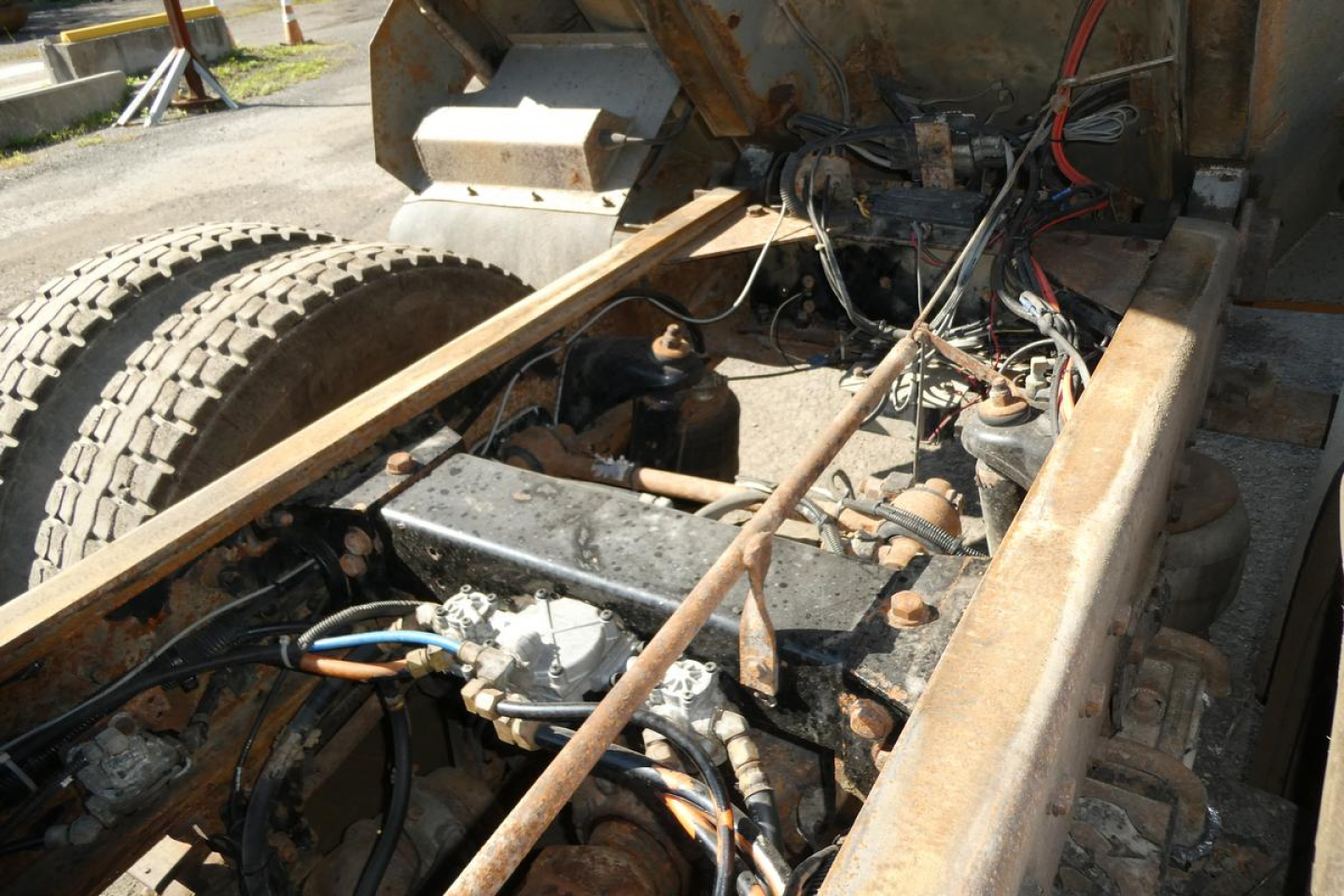 Peterbilt truck engine bay with exposed wiring and components.