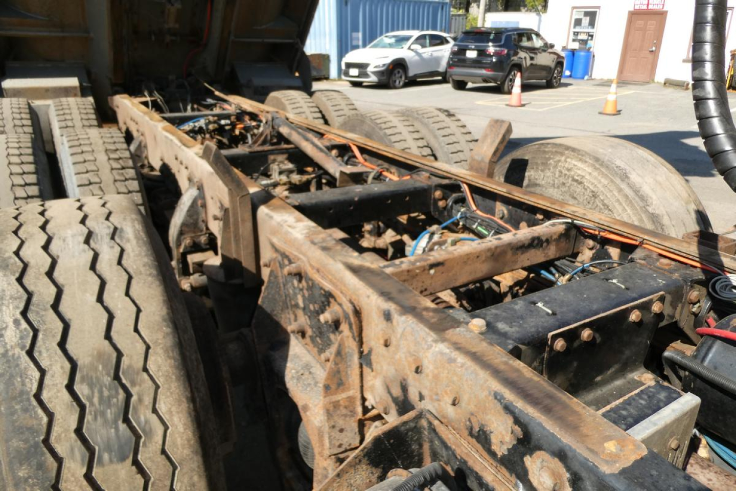 Peterbilt 357 frame and rear chassis showing rusted metal frame and drivetrain components.