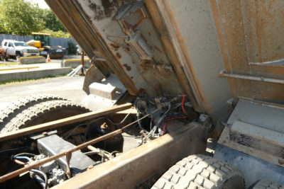 Peterbilt 357 dump truck bed interior showing hydraulic lines and chassis with exposed components