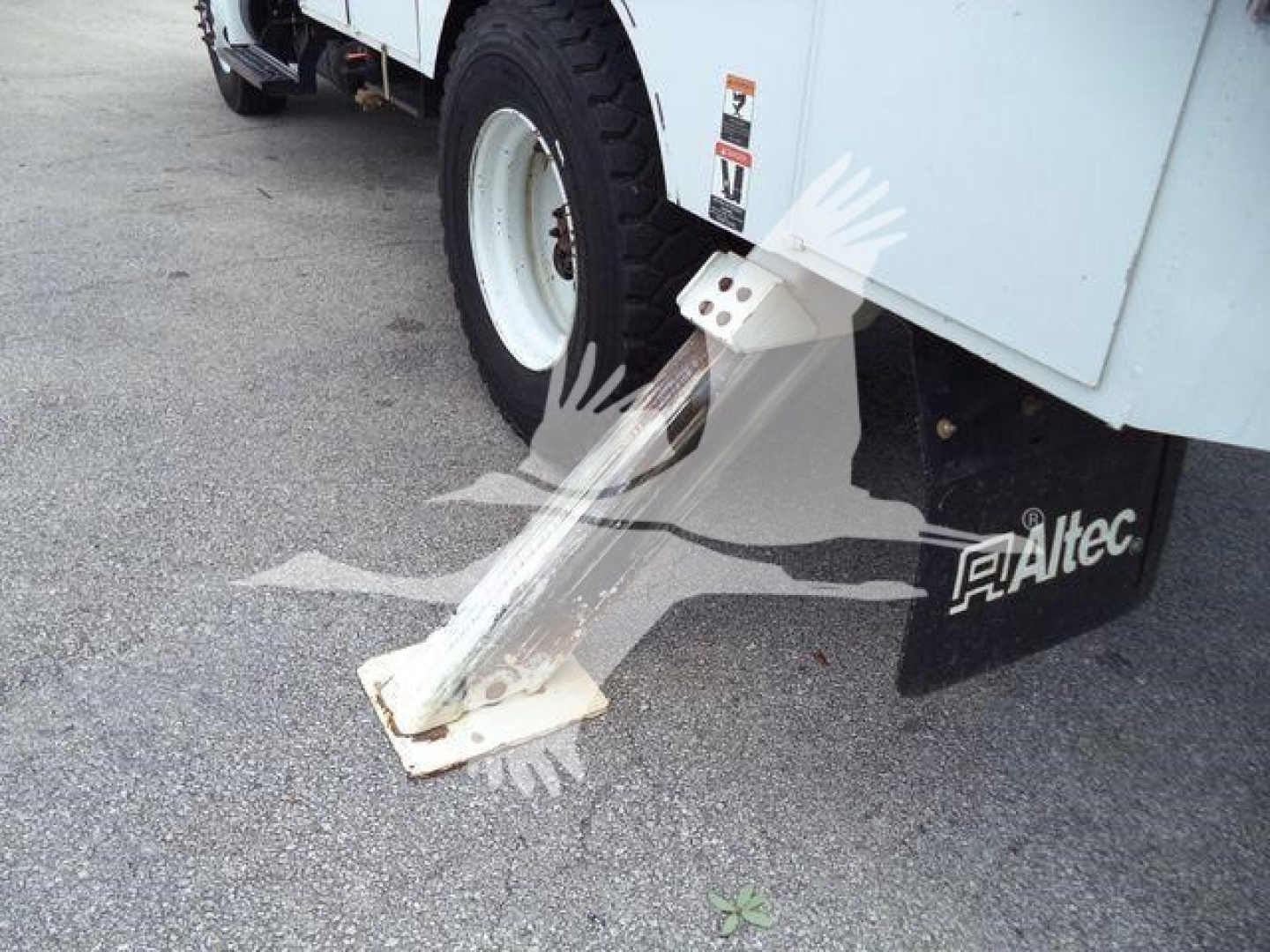 Altec L37M crane stabilizer pad and lower wheel area showing footpad and side branding.
